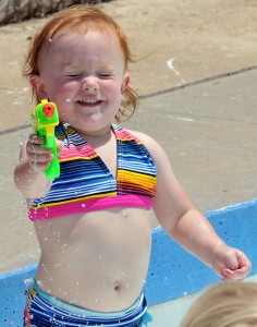 Reagan Burghart, 2, tests out a water gun at the Kendall Memorial pool. Reagan Burghart, 2, tests out a water gun at the Kendall Memorial pool.