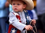 Stone Newell, 2, rides a pony through the children's parade during the Old Settlers' Reunion in Oskaloosa.