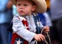Stone Newell, 2, rides a pony through the children's parade during the Old Settlers' Reunion in Oskaloosa.