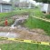 Caution tape defines the areas where diesel fuel overflowed from an underground tank and flowed into a residential neighborhood in McLouth Friday night. Photo by Clarke Davis