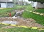 Caution tape defines the areas where diesel fuel overflowed from an underground tank and flowed into a residential neighborhood in McLouth Friday night. Photo by Clarke Davis