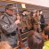 Ed Patterson (top left), Valley Falls, and Dylan Callahan, Emporia, provided a display of World War II uniforms and weapons for students to view during History Day at Valley Falls schools.