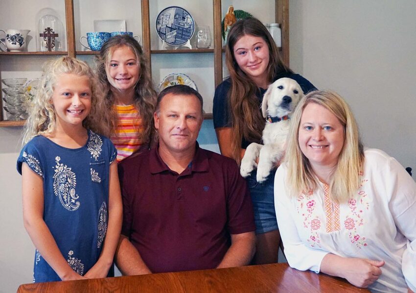 The Malone family (Nora, 9, Macy, 12, dad John, Megan, 14, puppy Lou, and mom Cindy) are preparing for the arrival July 24 of an exchange student from Japan, Satoka Suzuki.